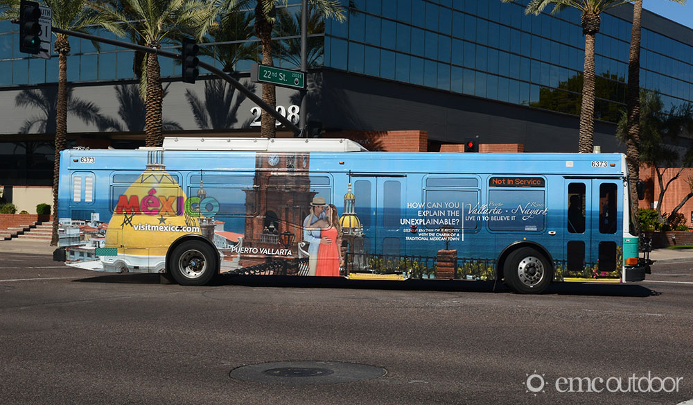 A wrapped bus with advertising for Mexico Tourism