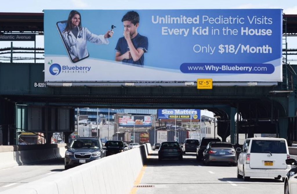 A billboard advertisement for a pediatric health service.