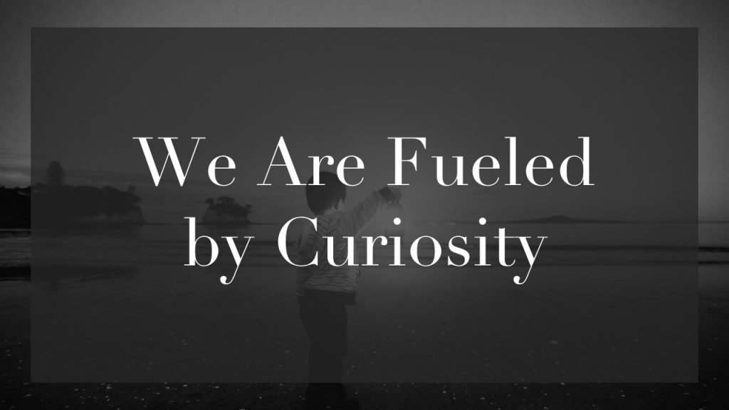 an image of a child holding a lantern with the text  "we are fueled by curiosity"