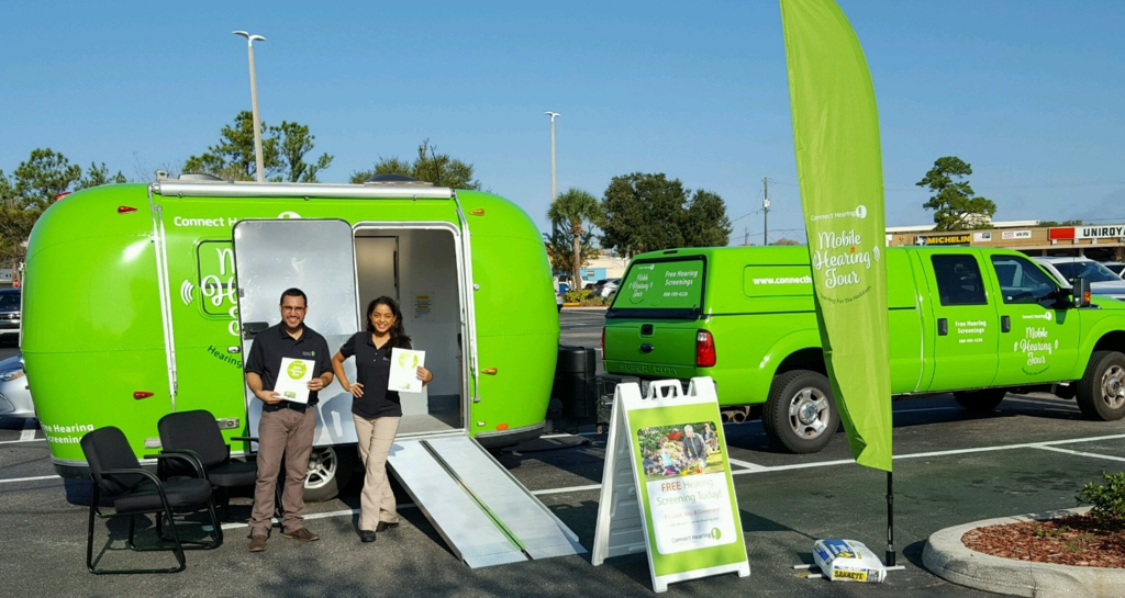 image of a wrapped trailer used to conduct mobile hearing screenings, reaching patients with out of home media