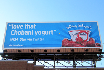 Using billboard advertising to Tweet about Greek yogurt.