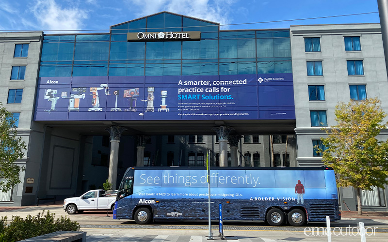 Bus wrap and hotel window wrap in front of hotel conference