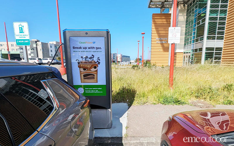 EV Charging Station with net-zero emissions message.