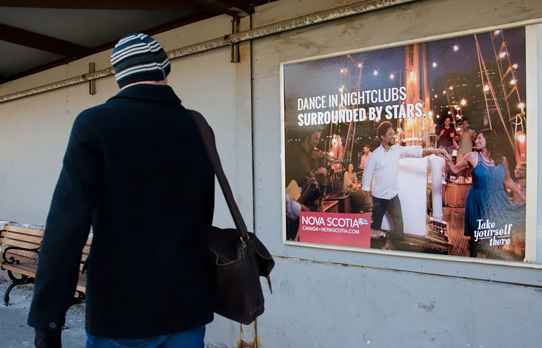 Image of commuter rail poster in Boston for a travel advertiser