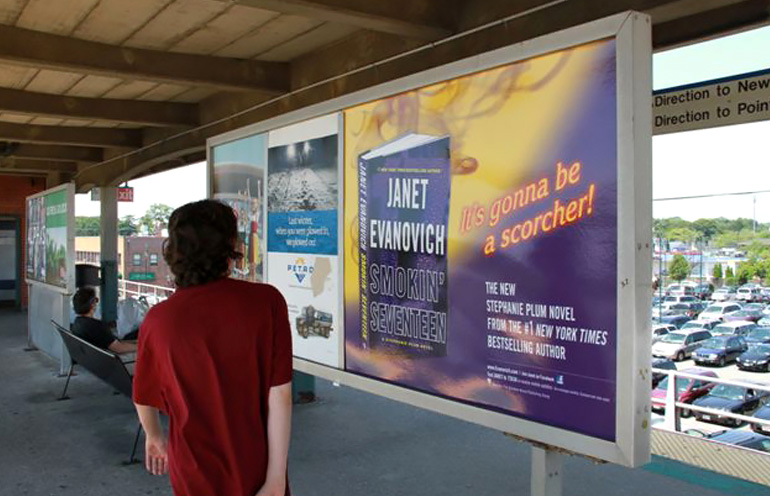 Image of a commuter rail platform poster