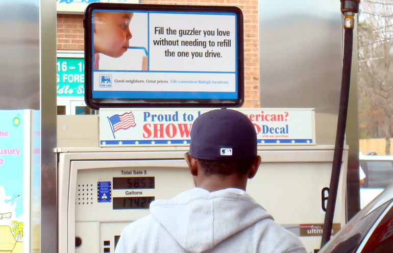 Image of gas station advertising for a supermarket chain