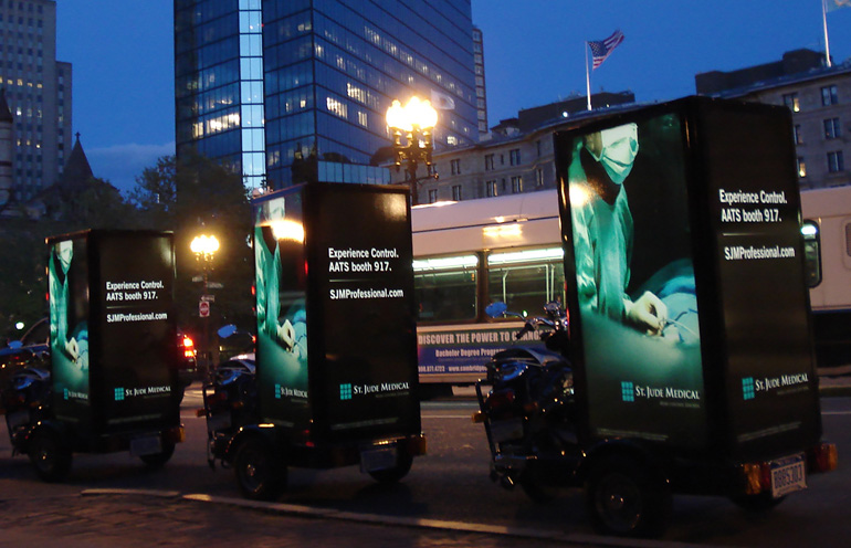 Image of backlit scooter advertising displays in Boston