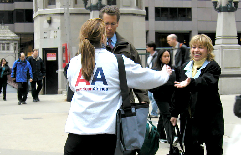 Image of a brand ambassador handing out promotional items in Chicago
