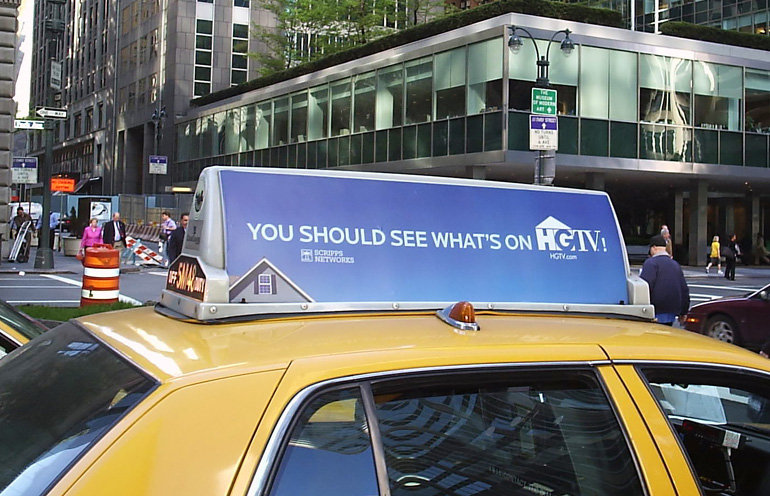 Image of taxi top advertising media reaching an urban audience