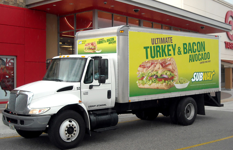 Image of truckside advertising used by a national restaurant chain to promote new menu items